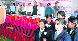 Students of Saraswati Shishu Mandir welcome the delgates at the convention in Mussoorie on Saturday.