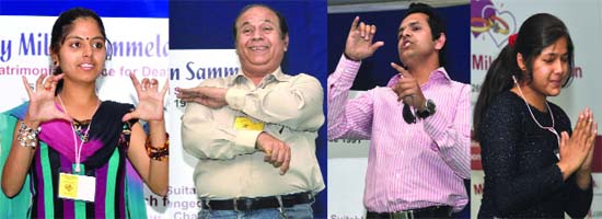 Hearing impaired persons gesture as they give details of their life during a mass wedding gathering--19th Pranay Milan Sammelan--organised by a matrimonial site in New Delhi