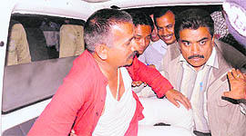 Congress MLA Kishore Upadhayaya being taken away by the police from his dharna site in front of the Assembly in Dehradun on Friday.