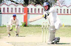 A batsman in action at the Dehradun District Cricket League in Dehradun