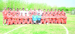 Players and officials from JCT FC pose with the visiting Wolverhampton Wanderers staff in Hoshiarpur on Friday.