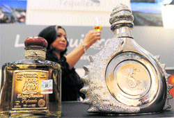 A woman presents Mexican Tequilla at the Pro Wein trade fair in the German city of Duesseldorf on Sunday. The three-day trade fair, which began on Sunday, is the largest of the international wine and spirits industry with 
