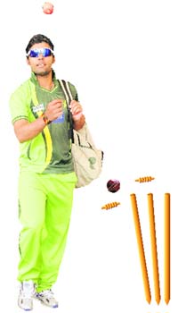 HEADS OR TAILS: Pakistan player Kamran Akmal tosses an apple while coming out of the PCA Stadium