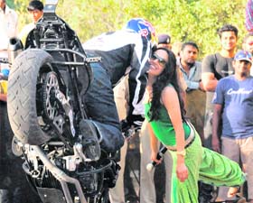 World freestyle biking world champion Chris Pfeiffer kisses a girl during a stunt at Sector 10, Chandigarh