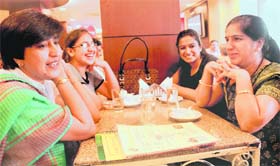 Raina, a schoolteacher, along with daughters Kairvi and Shruti, and friend Surinder at a restaurant in Sector 22