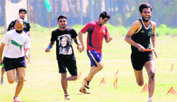 Athletes in action at the last day of the 10th annual sports meet of the FRI in Dehradun on Sunday. 