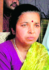 Khumkala Banjade, wife of Hemraj Banjade, speaks at a press conference in Noida on Sunday.