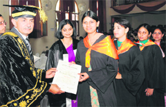 The Principal, RS Khanchi, confers a degree on a student during the convocation of Dyal Singh College in Karnal