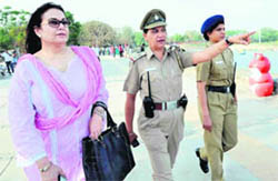 SECURED STROLL: Wife of the Pakistan team manager Intikhab Alam being escorted by Chandigarh Police women at Sukhna Lake