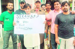 DREAMS SHATTERED: A group of disappointed cricket fans from Pakistan. The picture was sent on email to The Tribune.