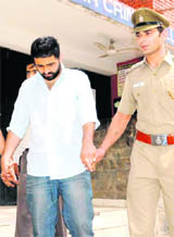 Accused Mandeep Singh Bhangu, a software engineer, being escorted by policemen on Monday.