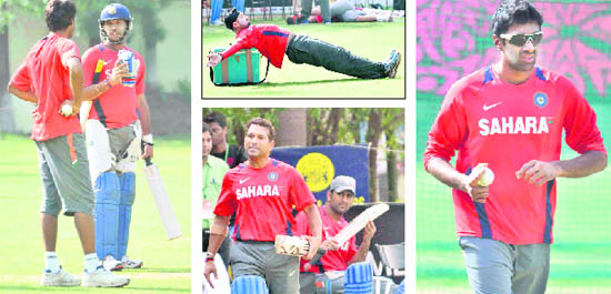 FINAL DELIBERATIONS: Yuvraj Singh and Munaf Patel during a practice session at the PCA Stadium in Mohali.