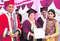 Education Minister Geeta Bhukkal presents a degree to a student at the convocation function of Pt. Nehru PG Government College in Jhajjar.
