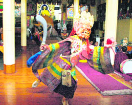 A Tibetan opera actor performs a traditional dance during a special prayer ceremony at the Dalai Lama temple in McLeodganj on Monday.