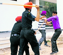 The police lathicharge a pharmacist protester near the PCA Stadium in Mohali on Monday. 