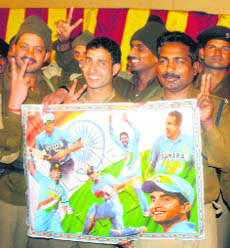 Jawans show their support to the Indian cricket team for the semifinal match of the World Cup against Pakistan, in Srinagar on Monday.
