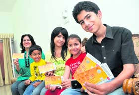 RARING TO GO: (From left) Sunita Sharma, Arnav, Kanika, Sanya and Kunal Sharma with their India-Pakistan match tickets in Ludhiana