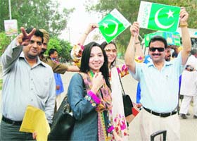 Cricket fans from Pakistan arrive at the Attari-Wagah checkpost on Monday to see the semifinal match at Mohali