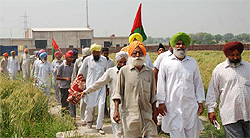 Villagers and farmer union leaders leave after police locked up the controversial bio-medical waste plant in Lehra Mohabbat on Tuesday.
