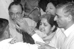 Former Mayor Harjinder Kaur being manhandled after she demanded a CBI inquiry into the booth scam during the MCs house meeting in Chandigarh
