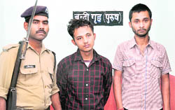 Shankar and his friend Anil in police custody in Dehradun
