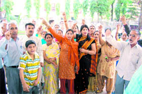 Residents of Bangarwala protest at the Jal Sansthan office in Dehradun on Tuesday