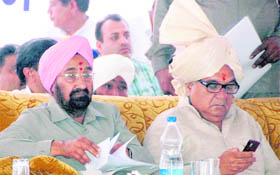 Chief Minister BS Hooda and Cooperation Minister Harmohinder Singh Chatha at a vikas rally at Pehowa in Kurukshetra on Tuesday.