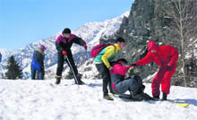 Tourists frolic in snow at Gulaba, about 20 km from Manali on the Manali-Rohtang road. 
