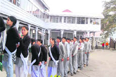 Schoolchildren stand in a queue to watch the Vidhan Sabha session in Shimla on Tuesday.