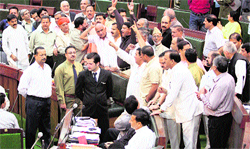 Legislators shout slogans in the Assembly in Jammu on Tuesday