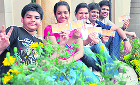 Sidhant, Mannat, Tanvi, Abhinav and Rishabh Oswal of Ludhiana flash their tickets to the semifinal match between India and Pakistan at Mohali.