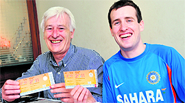Geoffrey and George (right) show tickets of the ICC World Cup semi-final match between India and Pakistan scheduled to take place in Mohali on Wednesday.