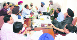 MC officials discuss a point at the F&CC meeting in Ludhiana on Tuesday.