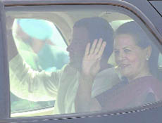 Sonia Gandhi and Rahul Gandhi wave to the mediapersons at the Chandigarh Airport.