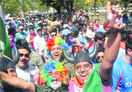 Fans cheer for the Indian cricket team outside the stadium in Mohali on Wednesday.