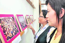 Two women at an exhibition Tibet - The Roof of the World in Dehradun on Wednesday. 