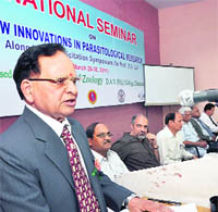 A speaker presents a paper during a national seminar on paracytological research at DAV PG College in Dehradun on Tuesday.
