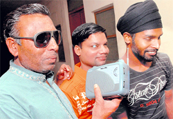 Inmates of a school for visually challenged listen to radio commentary of the semifinal match of the Cricket World Cup between India and Pakistan in Jalandhar on Wednesday