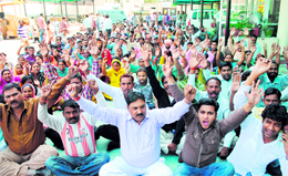 Members of the Safai Karamcharis Union of the Jammu Municipal Corporation stage a protest in support of their demands in Jammu on Wednesday