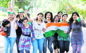 Girls cheer for Team India at Government College for Women on Wednesday
