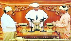 A TV grab shows newly-appointed President, former PM Thein Sein (centre), during his swearing-in ceremony in Naypyidaw