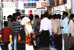 Bacchus lovers throng a liquor vend in Bathinda to benefit from the slashed prices as annual contract of the vend expired