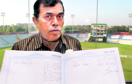 PCA spokesperson Sushil Kapoor shows the visitors book in Mohali on Thursday.