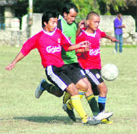 A match of the Vir Singh Memorial Football Tournament in progress at the OFD grounds in Dehradun on Thursday. 