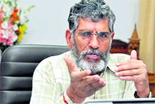 Diwakar Bhatt, Uttarakhand Food and Supplies Minister, addresses a press conference in Dehradun on Thursday