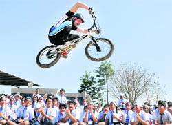 A German biker Daniel Rall performs a stunt at Sat Paul Mittal School in Ludhiana