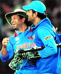 Sachin Tendulkar (L) and Mahendra Singh Dhoni celebrate after winning the semi-final against Pakistan in Mohali on Wednesday. India beat Pakistan by 29 runs