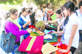 Students buy products made by the underprivileged children at student centre, Panjab University, on Friday. 