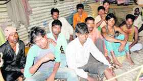 Labourers mourn the death of their co-workers in Chandigarh on Monday.