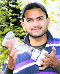 Abhijit Chadha is all smiles as he holds the Northern India Amateur Golf Championship trophy at the Chandigarh Golf Club on Friday. 
